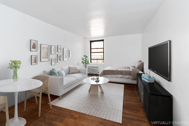 living room with dark hardwood / wood-style flooring