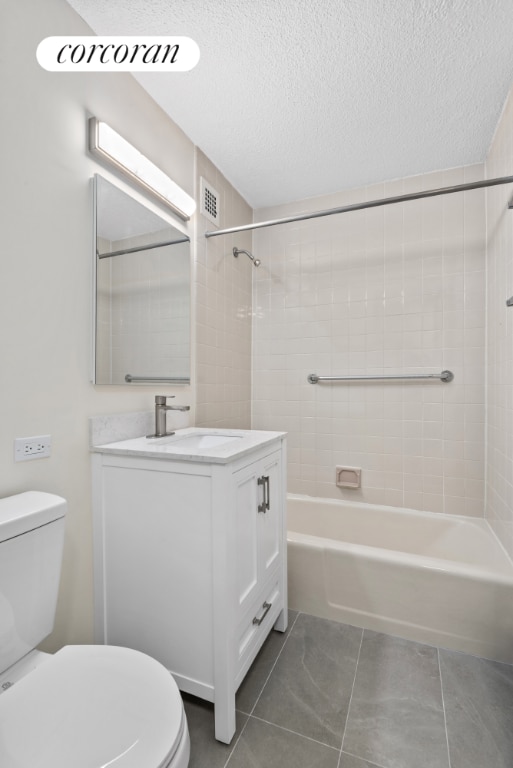 full bathroom featuring visible vents, a textured ceiling, vanity, and toilet