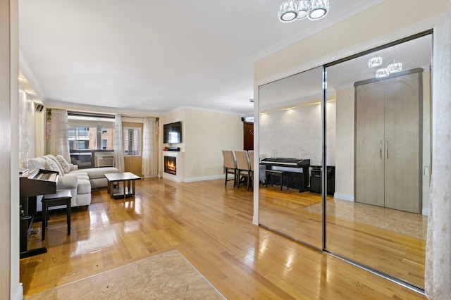 61-35 98th St Unit 15-E, New York City, NY 11374 - living area with hardwood / wood-style flooring, a chandelier, and crown molding