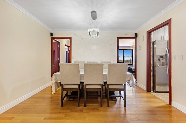 61-35 98th St Unit 15-E, New York City, NY 11374 - dining space featuring a chandelier, light wood finished floors, and ornamental molding