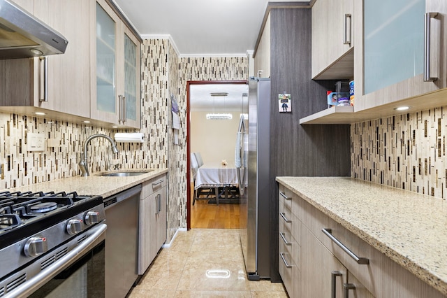 61-35 98th St Unit 15-E, New York City, NY 11374 - kitchen with appliances with stainless steel finishes, range hood, ornamental molding, light stone countertops, and tasteful backsplash