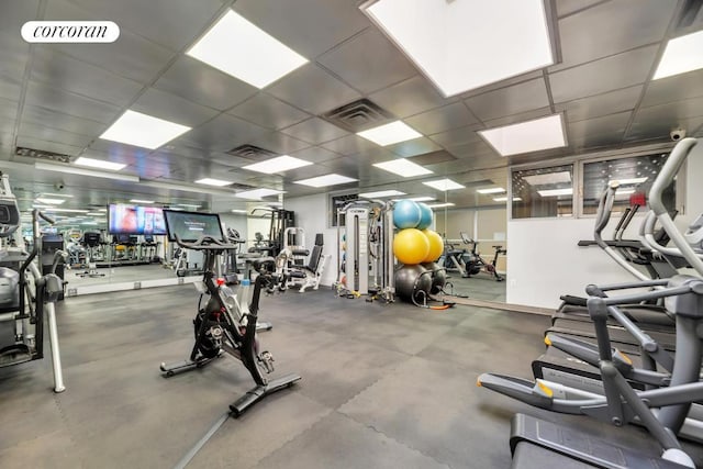 workout area featuring a drop ceiling