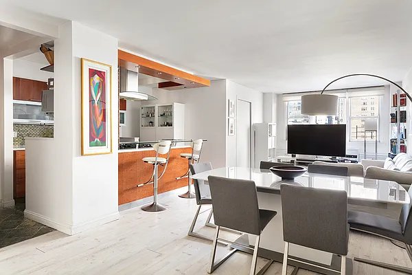 dining space with wood finished floors