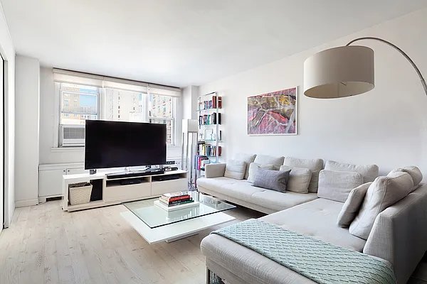 living room featuring light wood-type flooring and cooling unit