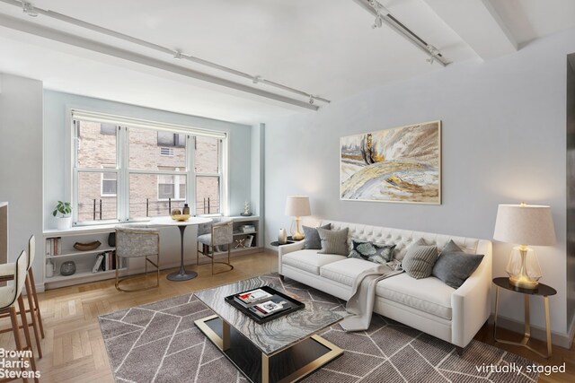 living room featuring parquet flooring and rail lighting