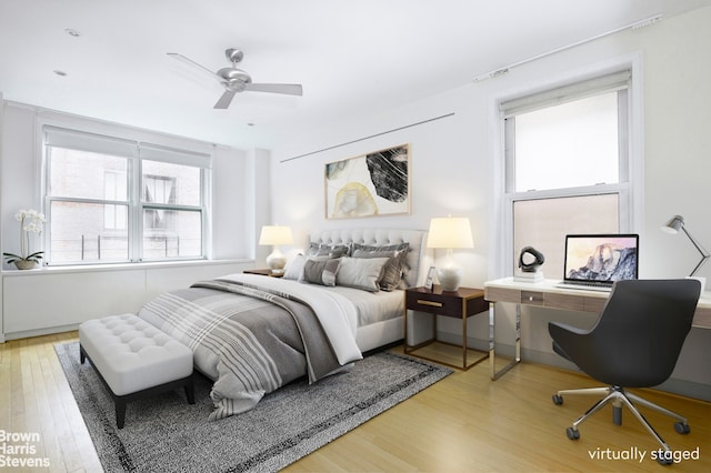 bedroom featuring ceiling fan and light wood-type flooring