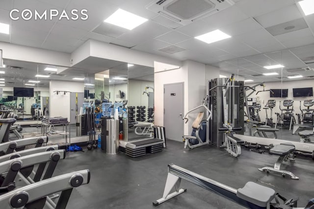 workout area featuring a paneled ceiling