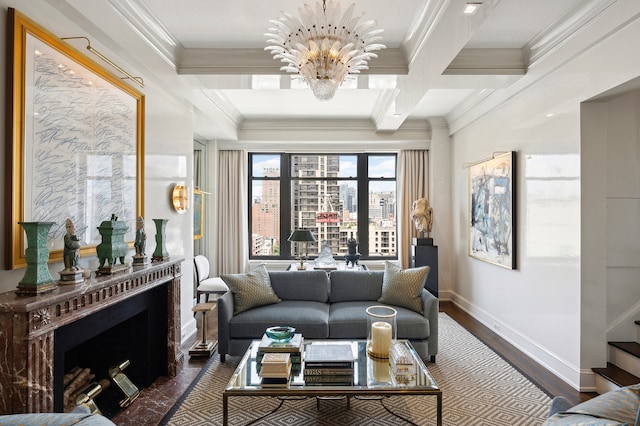 interior space with a notable chandelier, wood finished floors, baseboards, ornamental molding, and stairway