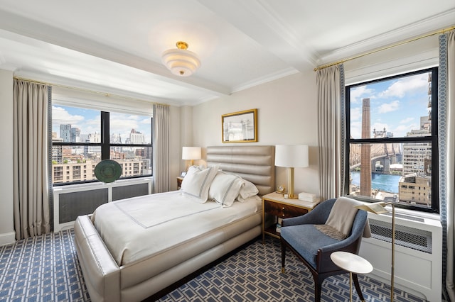 carpeted bedroom featuring beam ceiling, a city view, and crown molding