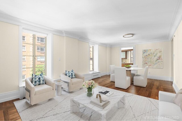 living room featuring a wealth of natural light, ornamental molding, and wood-type flooring