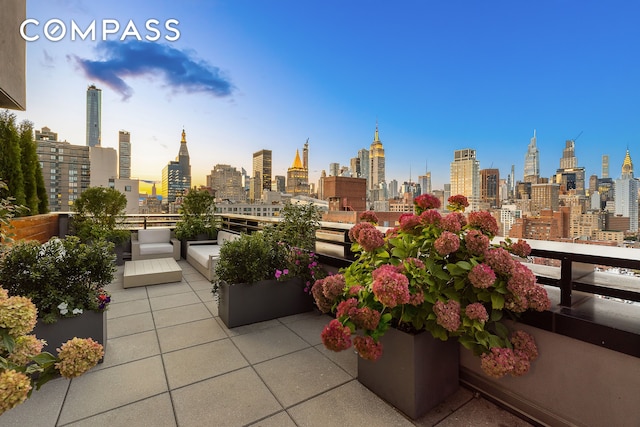 exterior space with a view of city and a balcony