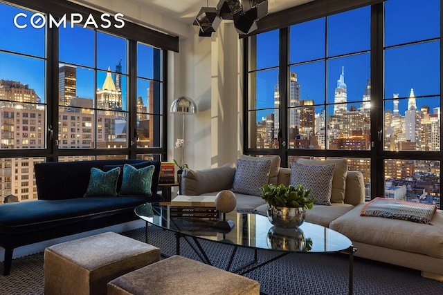 living area featuring a city view and a wall of windows