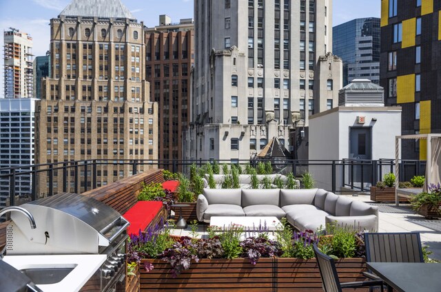 balcony with a view of city, outdoor lounge area, and area for grilling