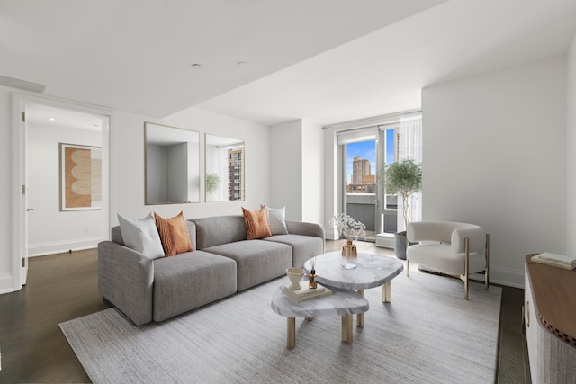 living room with dark hardwood / wood-style floors