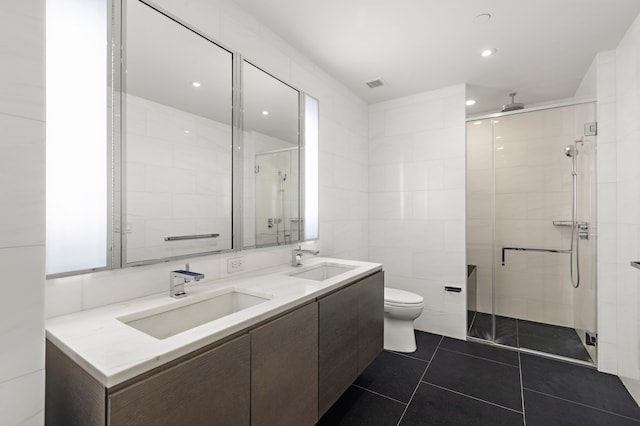 50 Riverside Blvd Unit 17-F, New York City, NY 10069 - full bath featuring a shower stall, double vanity, tile patterned floors, recessed lighting, and tile walls