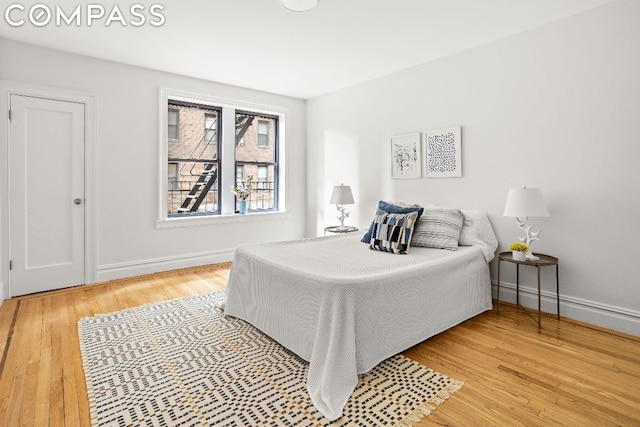 bedroom with hardwood / wood-style flooring