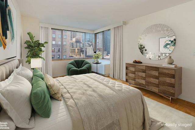 bedroom featuring parquet flooring