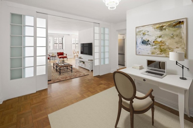 office space with french doors, an inviting chandelier, and dark parquet floors