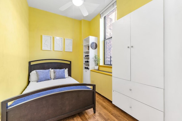 bedroom featuring ceiling fan and wood-type flooring