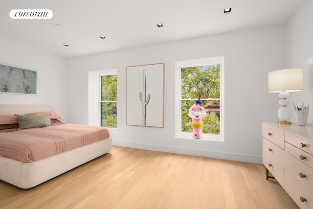 bedroom with recessed lighting, light wood-type flooring, visible vents, and baseboards