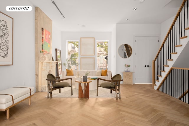 living area featuring stairs, visible vents, and recessed lighting