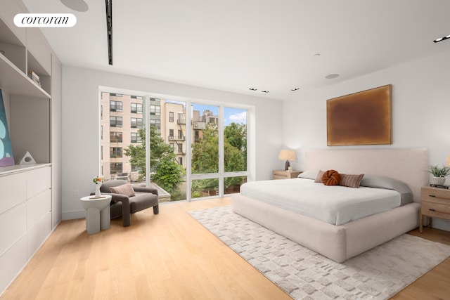 bedroom with visible vents and wood finished floors