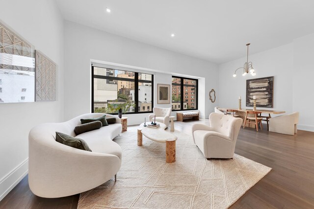 living room with a chandelier and wood-type flooring