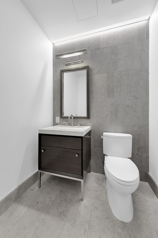 301 E 50th St Unit 4D, New York City, NY 10022 - half bath featuring vanity, toilet, and baseboards
