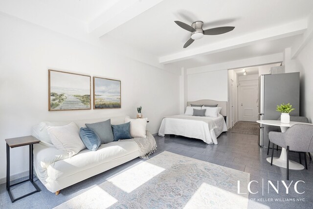 laundry room featuring stacked washer and dryer, washing machine and dryer, and light tile patterned flooring