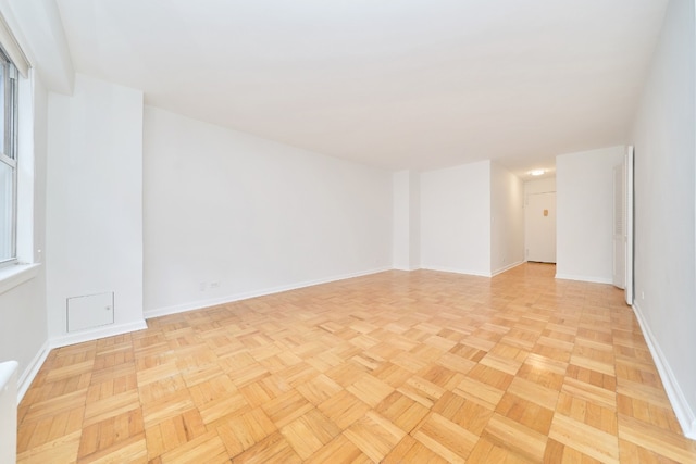 empty room with baseboards