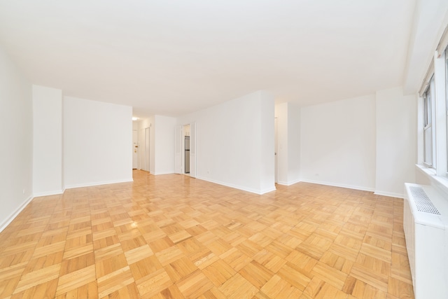 empty room with baseboards