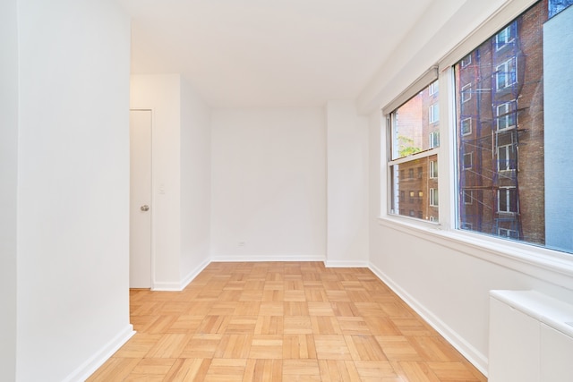 spare room featuring baseboards