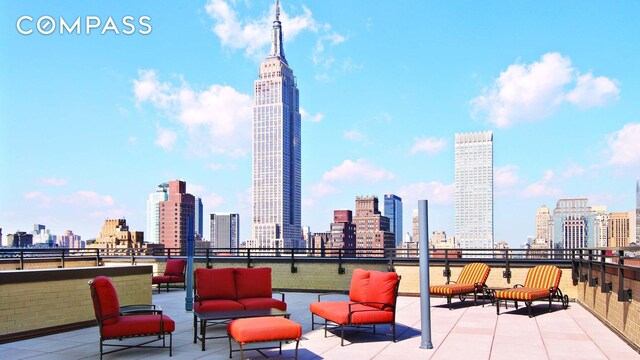 137 E 36th St Unit 6G, New York City, NY 10016 - view of patio / terrace featuring a view of skyline and an outdoor living space