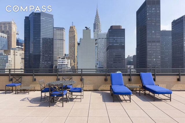 view of patio / terrace featuring a city view