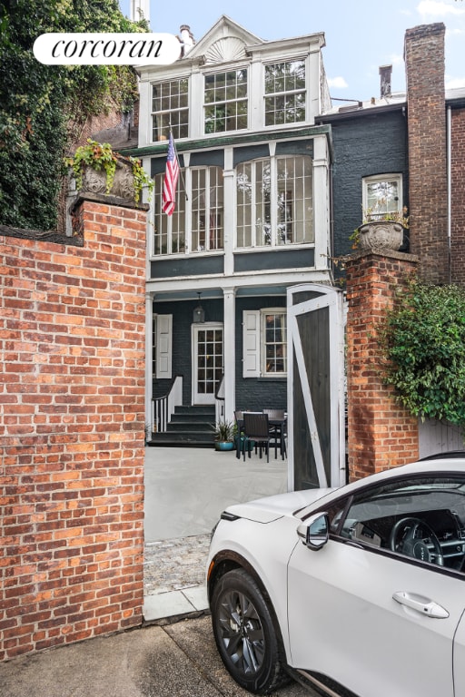 view of front of house featuring brick siding