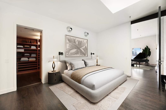 interior space with built in fridge, a towering ceiling, wine cooler, decorative backsplash, and dark wood-type flooring