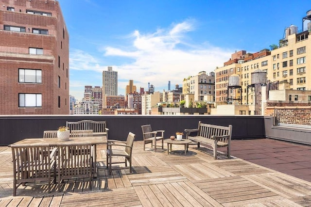 wooden deck with a view of city