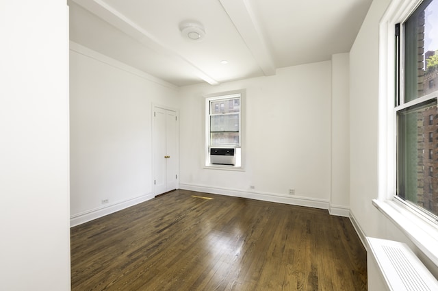 131 E 93rd St Unit 7A, New York City, NY 10128 - unfurnished room with beamed ceiling, dark wood-type flooring, and baseboards
