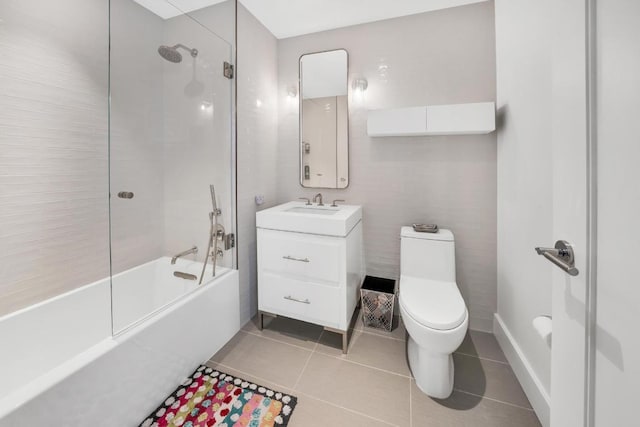 bathroom with toilet, tile patterned flooring, and vanity