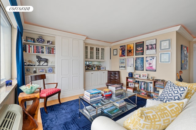 living room featuring dark wood-style floors and crown molding