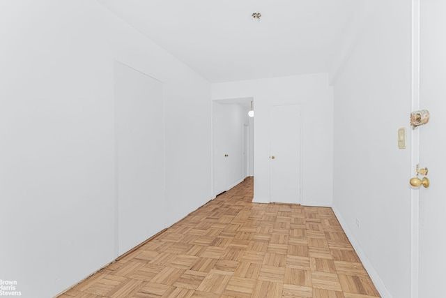 unfurnished room with light parquet floors