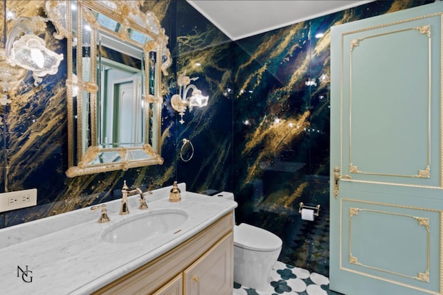 bathroom featuring toilet and vanity