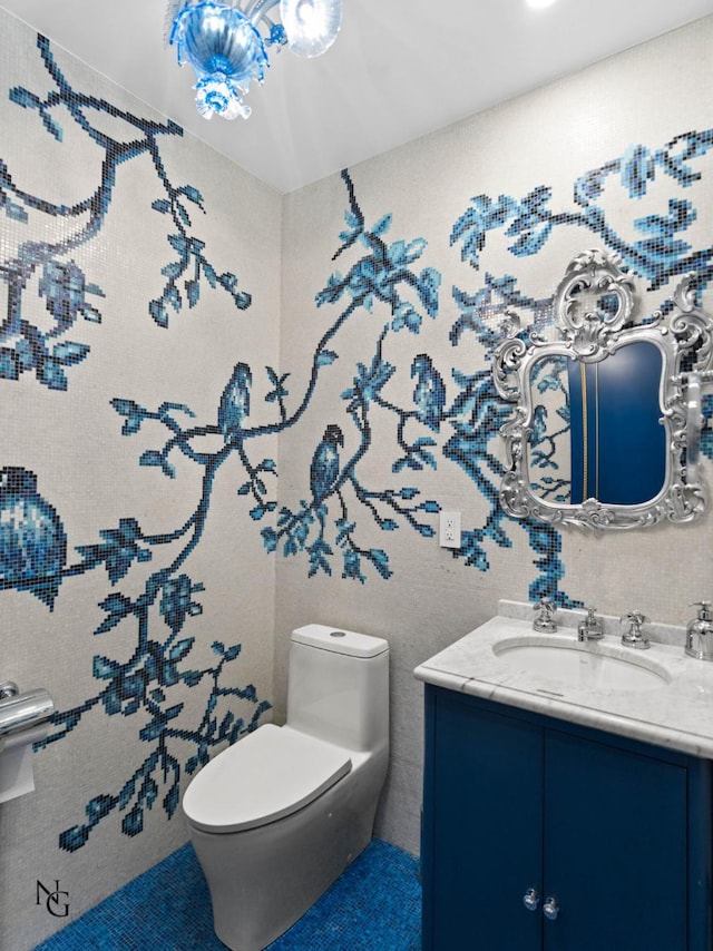 bathroom with toilet and vanity