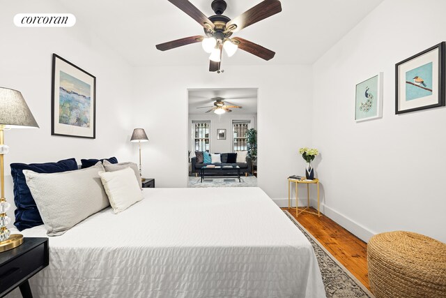 tiled bedroom with crown molding, radiator heating unit, and ceiling fan