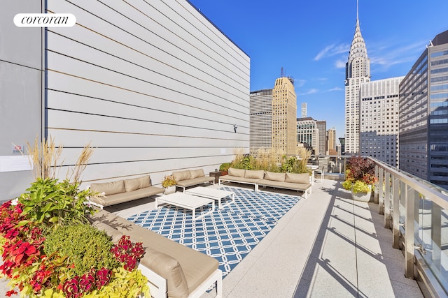 view of patio featuring an outdoor hangout area, a balcony, and a view of city