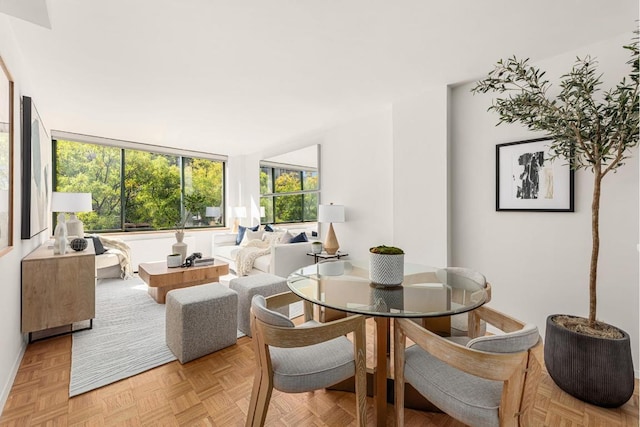 dining space with light parquet floors