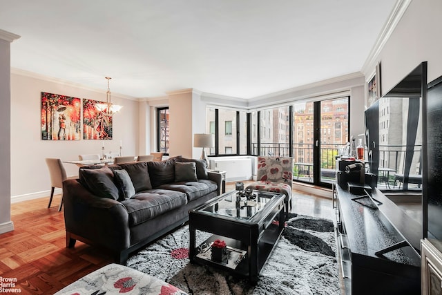 living area featuring crown molding, baseboards, and a chandelier