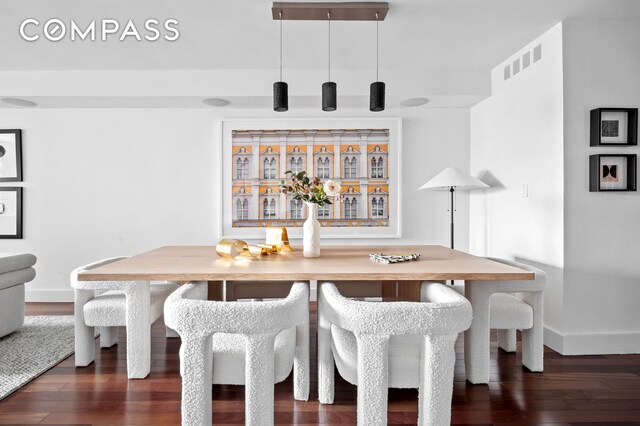 dining area featuring dark hardwood / wood-style flooring