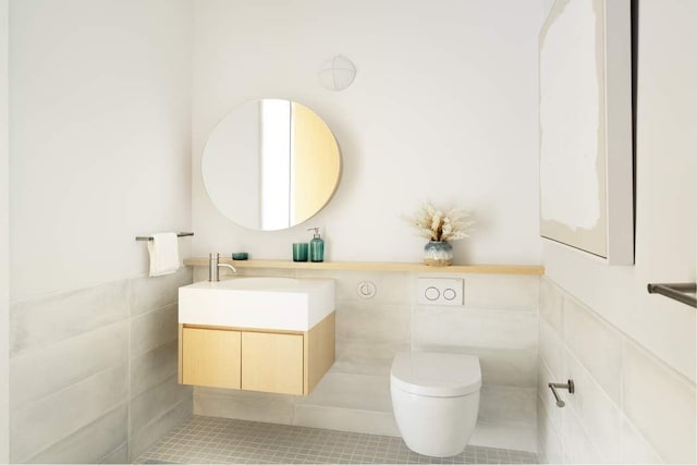 bathroom featuring vanity, tile patterned floors, and toilet