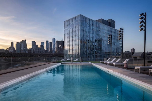 view of pool at dusk